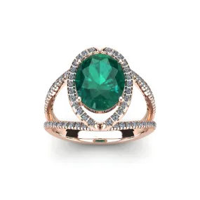 1 1/2 Carat Oval Shape Emerald And Halo Diamond Ring In 14 Karat Rose Gold